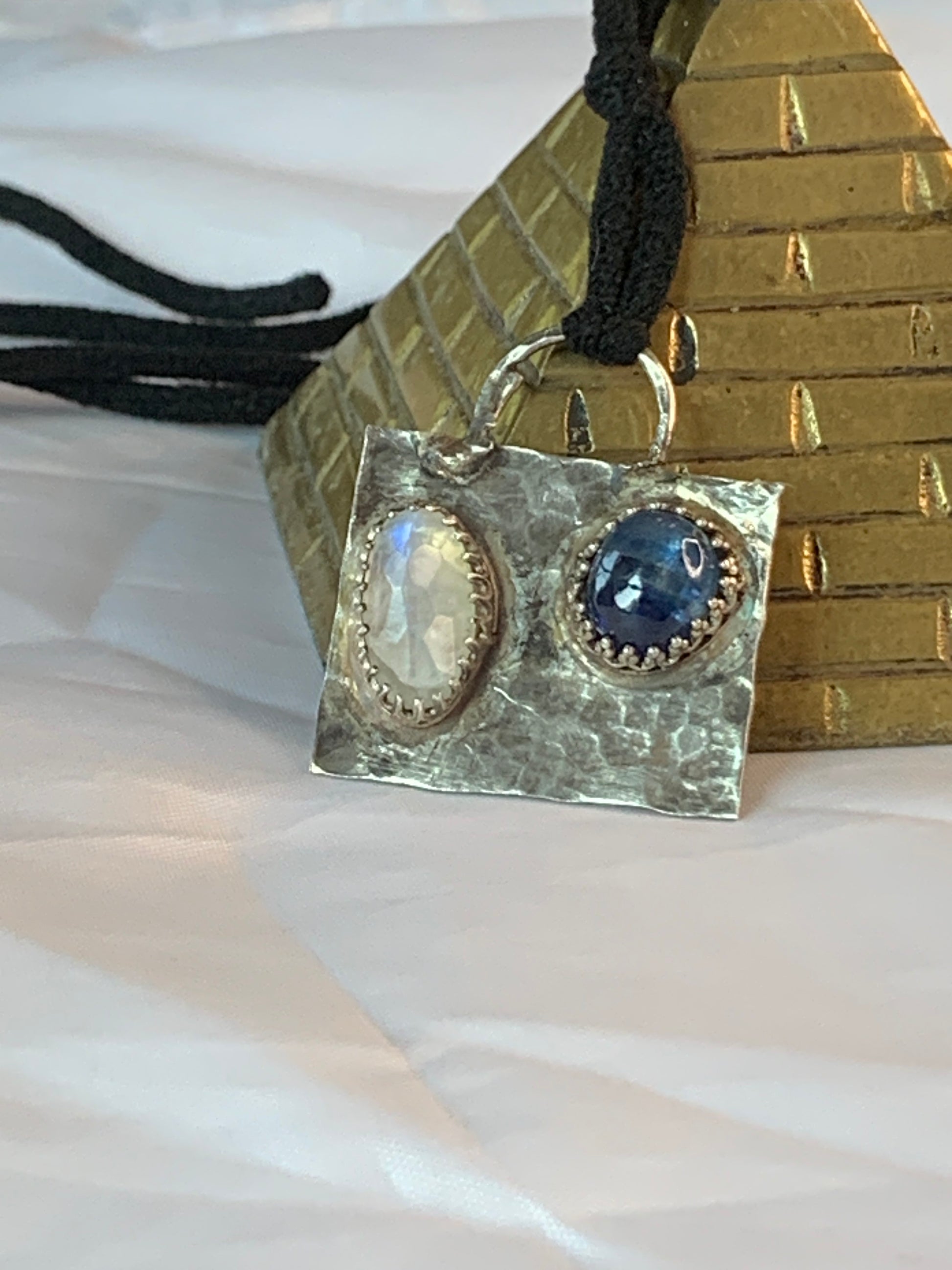 Whether you're looking to embrace the calming energy of gemstones, elevate your style with artisan craftsmanship, or simply make a statement, this pendant is a reflection of your individuality.