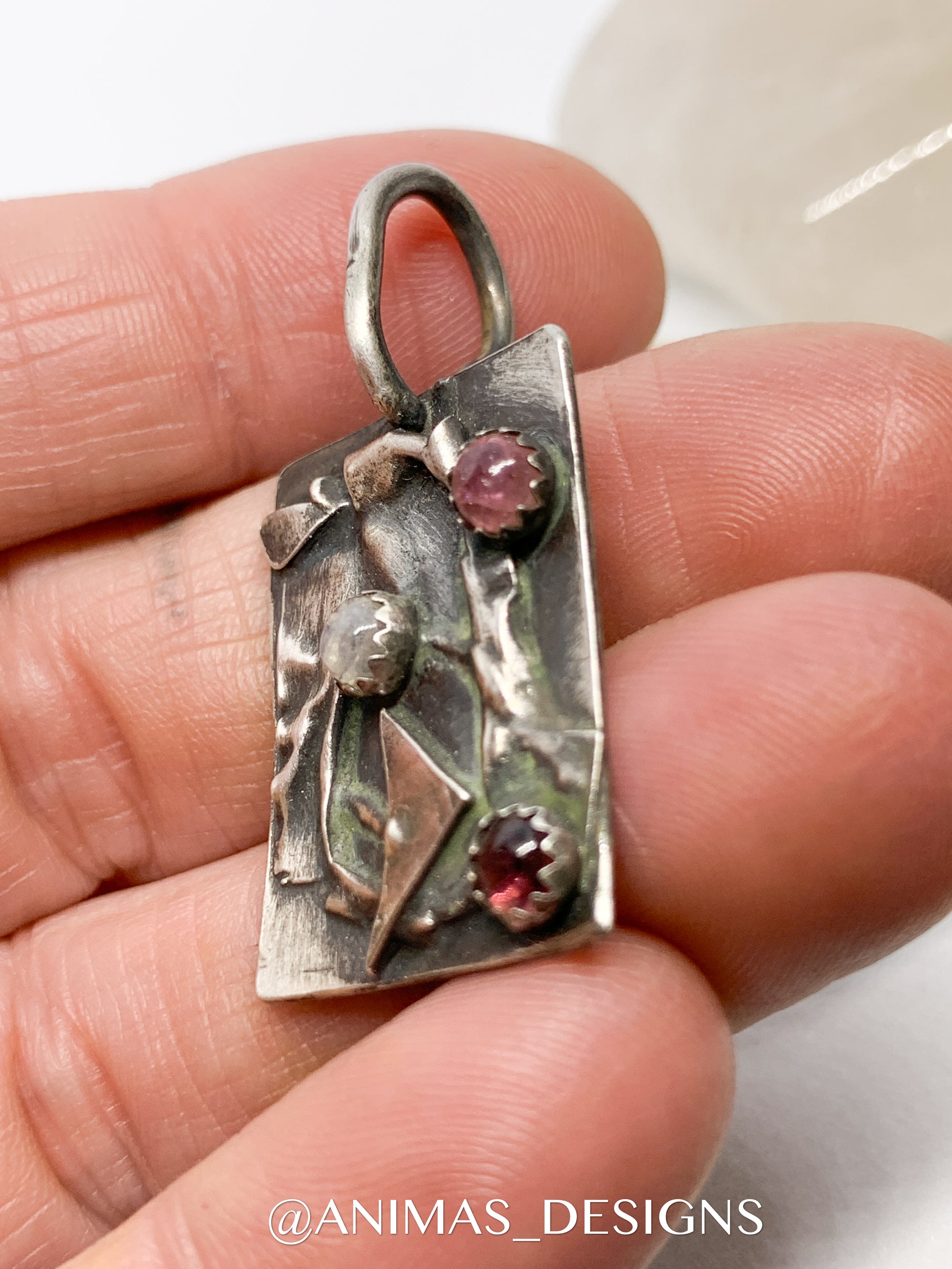 Designer jewelry made from sterling silver with pink tourmaline stones. Made in Colorado. 