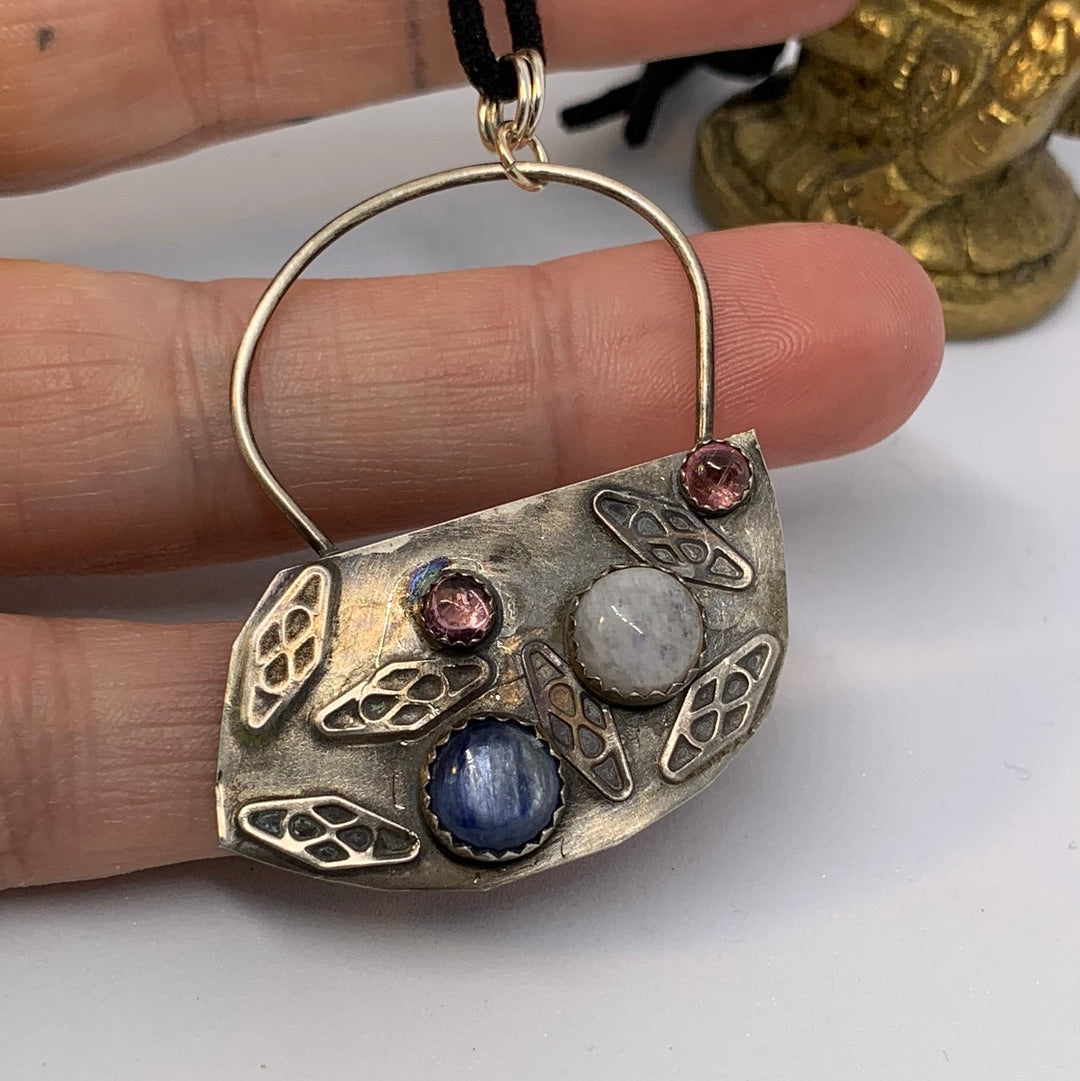 One of a kind design. Large oxidized pendant with moonstone, kyanite, and pink tourmaline stones. Authentic sterling silver. All of our items are made in USA. 